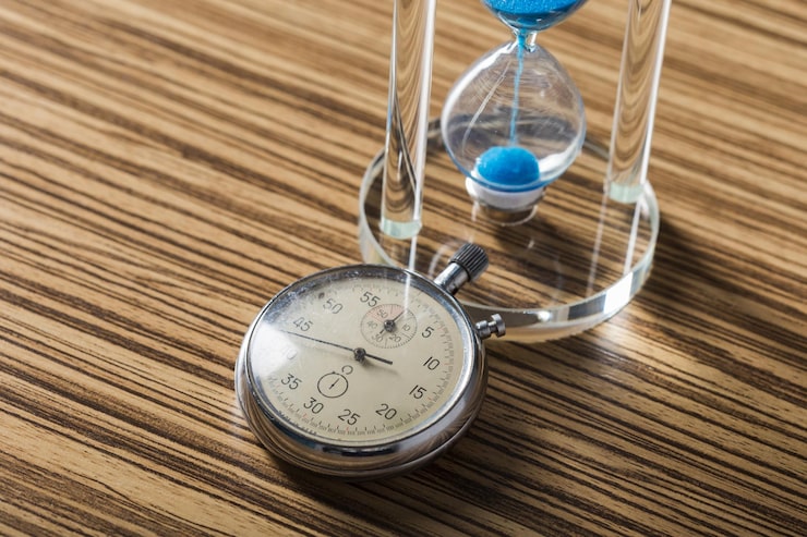 time-is-passing-blue-hourglass-close-up_93675-129179