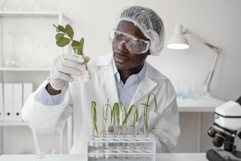 medium-shot-researcher-holding-plant